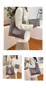 Detail of grey lattice tote bag set with matching zippered clutch and faux leather straps
