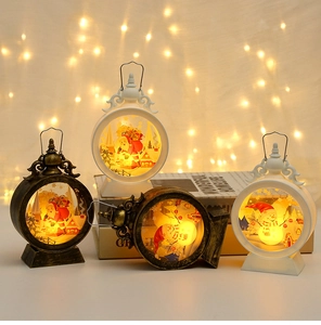 Close-up of Christmas lanterns with Santa Claus and Snowman prints in warm festive lighting