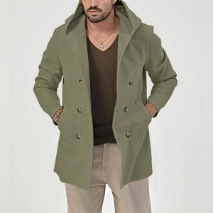 Detail of olive green double-breasted trench coat with hood and buttoned front