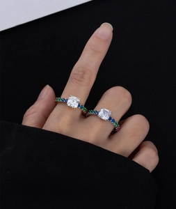 Close-up of 925 silver ring featuring square Asscher cut diamond and colorful pavé stones