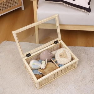 Handwoven rattan storage box with transparent glass lid and metal hinges for home organizing