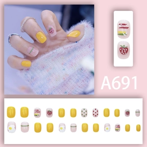 Cute fruit press-on nails set with strawberry and egg designs in yellow and pink