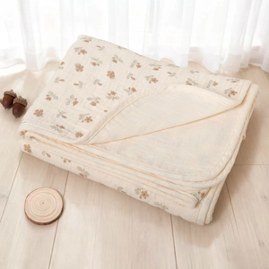 Detail of soft multi-layer cotton baby blanket with vintage brown floral print