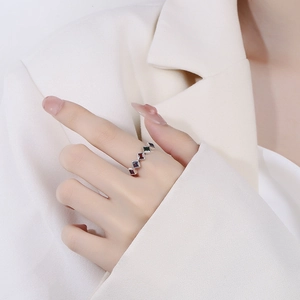 Minimalist silver ring with colorful square zircon stones worn on model hand