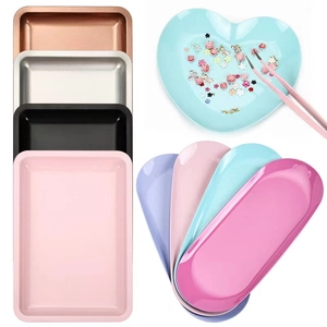 Square, heart, and oval stainless steel jewelry trays in multiple metallic finishes