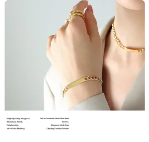 Detail of 18K gold plated titanium steel chain bracelet with a rectangular ID plate
