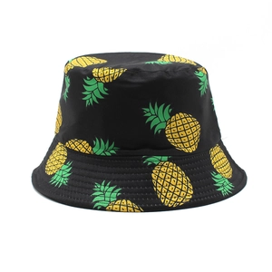 Women's black bucket hat featuring vibrant pineapple prints for summer outdoor sun protection