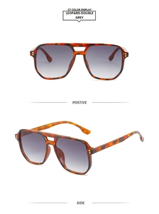 Detail view of leopard print aviator sunglasses with double bridge and metal stud accents