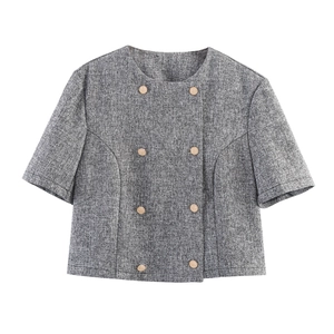 Detail of grey short sleeve tweed jacket featuring a double-breasted button design