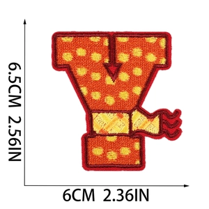 Letter Y embroidery patch with orange base and yellow dots showing 6.5cm height dimension