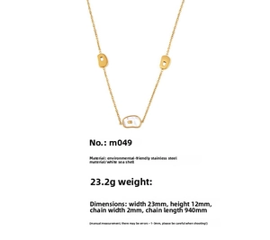 Detailed view of long gold necklace with white shell pendants and precise dimensions