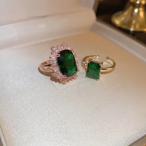 Vintage emerald green open rings with halo rectangle and sugarloaf stones in rose gold finish