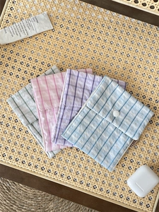 Floral fabric sanitary napkin pouch set in four pastel colors with button closure