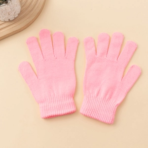 Close-up of pink knitted gloves featuring elastic ribbed cuffs and fine knit texture