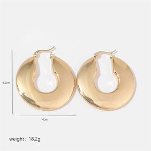 Detail view of chunky gold chunky hoop earrings showing 4.2cm height and 4cm width dimensions