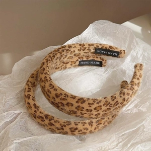 Set of two plush leopard print headbands with a stylish vintage sponge padded design