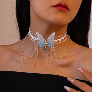 Lace choker with a blue crystal butterfly pendant and elegant fringe tassel accents
