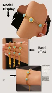 Macro detail of wide mesh gold bracelets with round turquoise stones and pendant tags