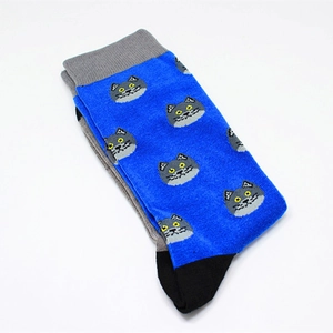 Detailed knit texture of blue cotton crew socks featuring grey cat jacquard patterns