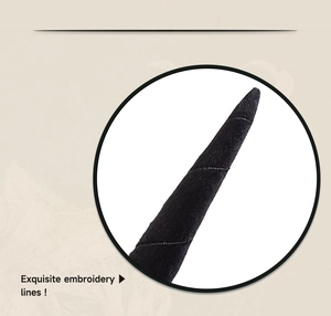 Detailed close-up of exquisite spiral embroidery on black cotton halloween ox horns