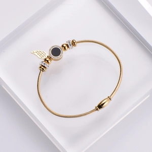 Gold stainless steel wire bangle featuring angel wings and black zircon charms