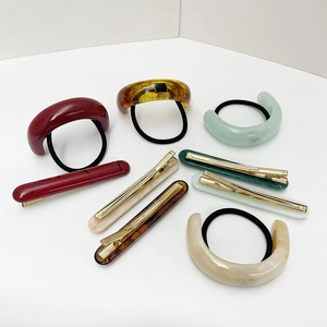Resin U-shape hair ties and ponytail clips set in assorted colors on white background