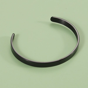 Macro shot of 6mm black matte stainless steel cuff bracelet with open C-shape design