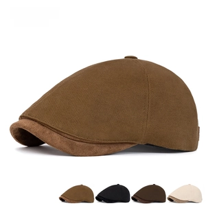 Detailed view of British style beret showing twill cotton texture and suede brim accents