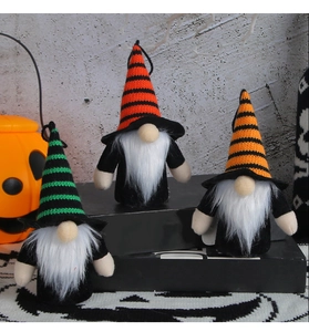 Three Halloween glowing gnomes with striped hats on spiderweb background decor