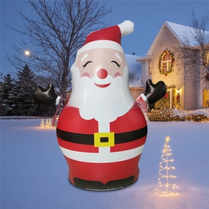 Inflatable Santa Claus outdoor decoration with LED lights set in a snowy night courtyard
