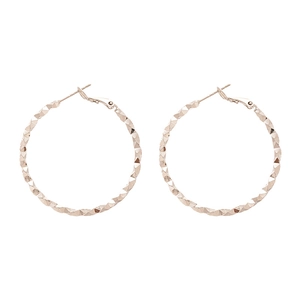 Minimalist twisted geometric circle earrings in rose gold with diamond-cut texture surface