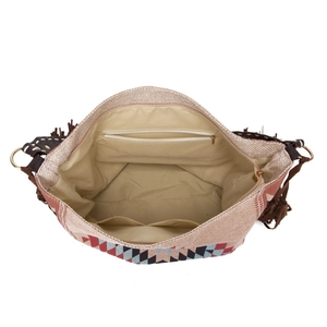 Detailed view of bohemian woven tote bag interior with zip pocket and beige lining