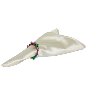 Easter napkin ring with colorful berries and brown woven texture on white satin cloth