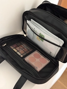 Large capacity black travel cosmetic bag with double layer interior and PVC compartment