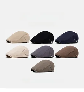 Flat lay display of British style cotton flat caps in seven colors with metal buckles