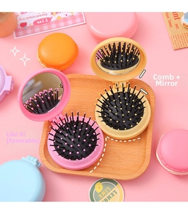 Foldable macaron hairbrush with mirror detail, compact pastel candy color massage comb