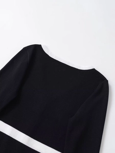 Detail of V-neck collar and high-density knit fabric on contrast color cardigan