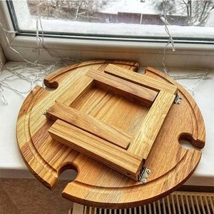 Foldable circular wooden picnic wine table with four glass holder slots and light grain