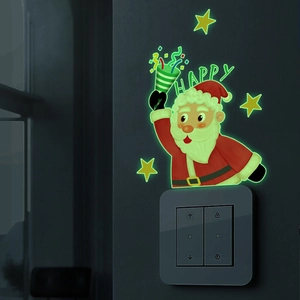 Glow-in-the-dark Santa Claus and stars wall sticker showing luminous effect at night