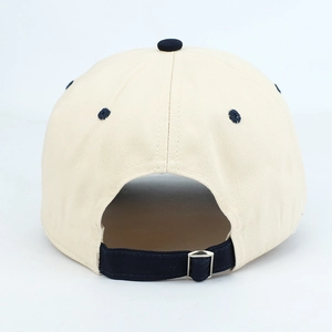 Detail view of cotton baseball cap back with navy blue adjustable strap and metal buckle