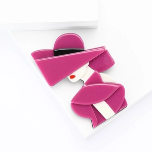 Artistic acrylic Marilyn brooch with magenta oversized hat on a geometric background