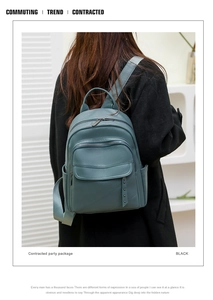 Blue rivet backpack on model's back featuring large capacity and stylish commuting look