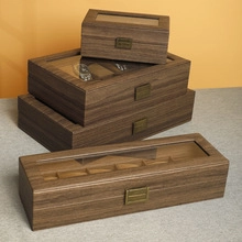 Detailed view of stackable dark brown wood grain jewelry boxes with vintage metal clasps