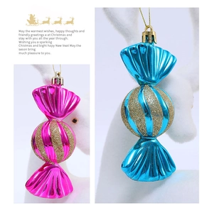 Detail of electroplated candy ornaments with gold glitter spiral on pink and blue balls