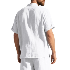 Rear view of men's white linen short sleeve shirt showing fit and fabric texture