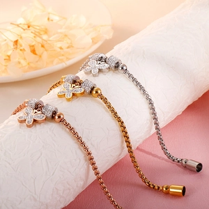 Macro detail of adjustable butterfly box chain bracelets with sparkling rhinestones