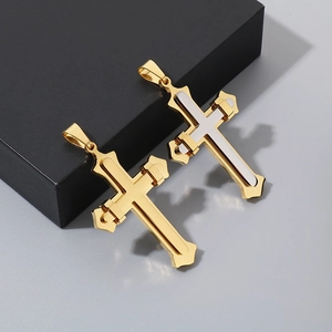 Detailed view of dual-layer stainless steel cross pendants in gold and two-tone silver gold