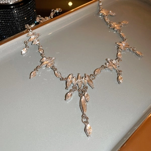 Macro shot of silver hip-hop fringe necklace with marquise-cut rhinestones on tray