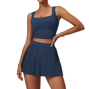 Navy blue sports set featuring a square-neck crop top and high-waisted pleated tennis skirt
