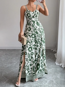 Detail of floral printed jumpsuit featuring side slits and elegant wide leg design